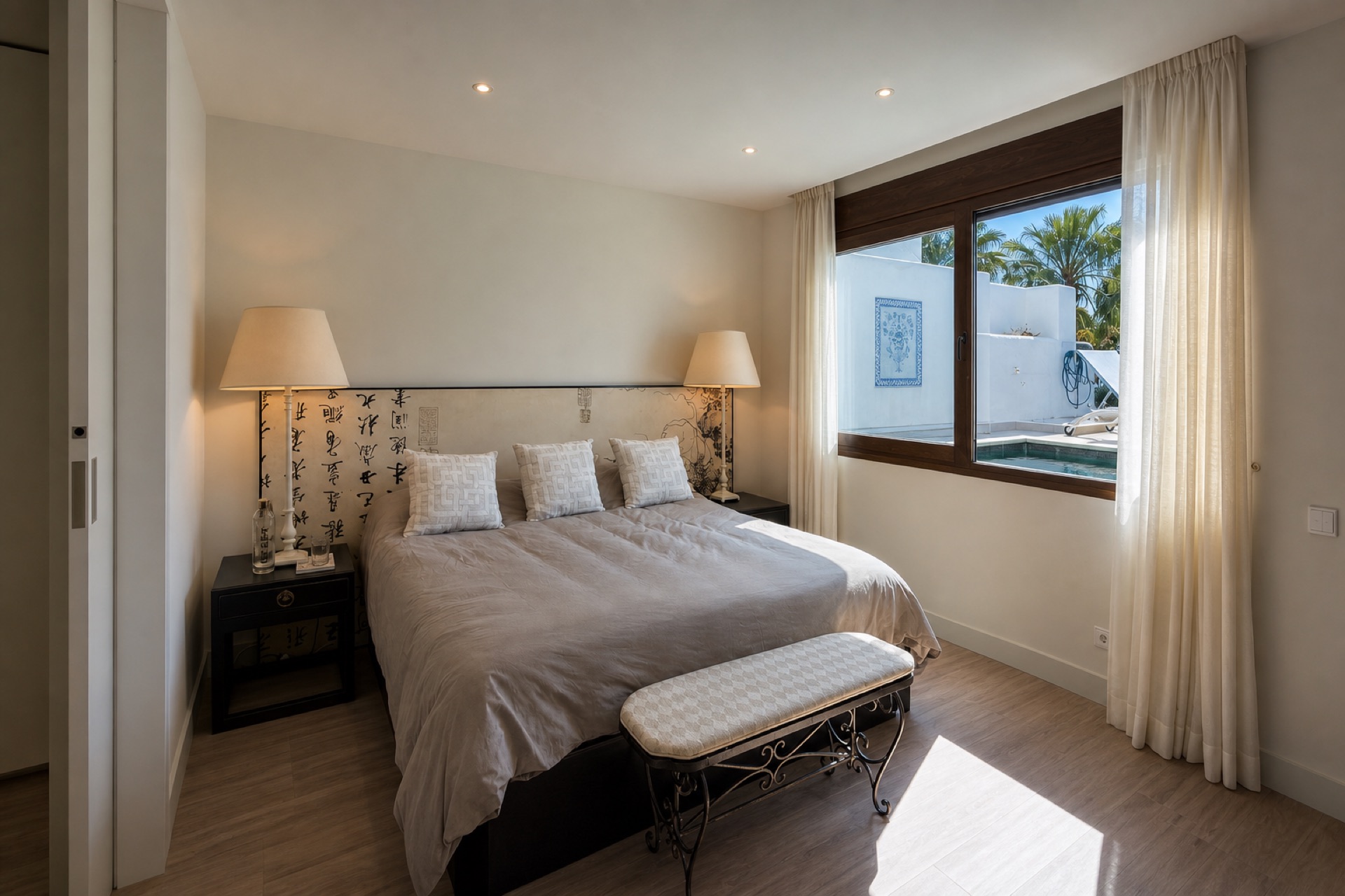 Bright bedroom with private pool view at the La Isla penthouse