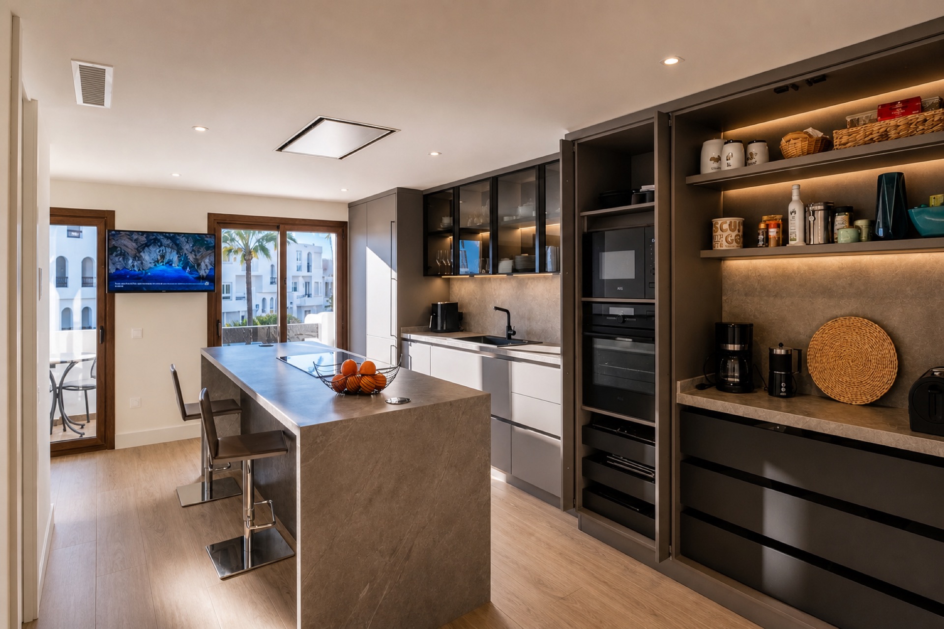 Modern kitchen with island at the La Isla penthouse