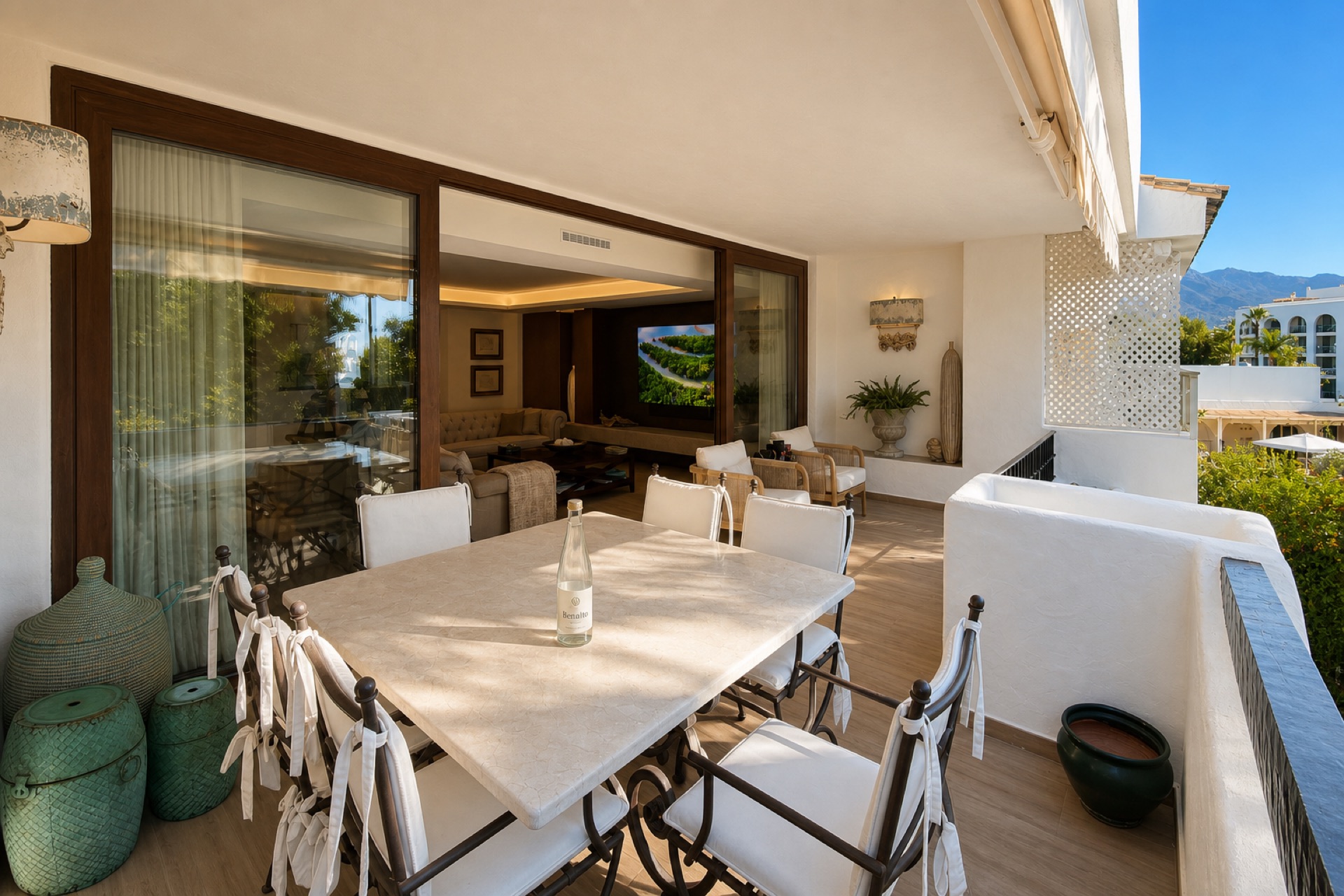Covered terrace with dining area at the La Isla penthouse