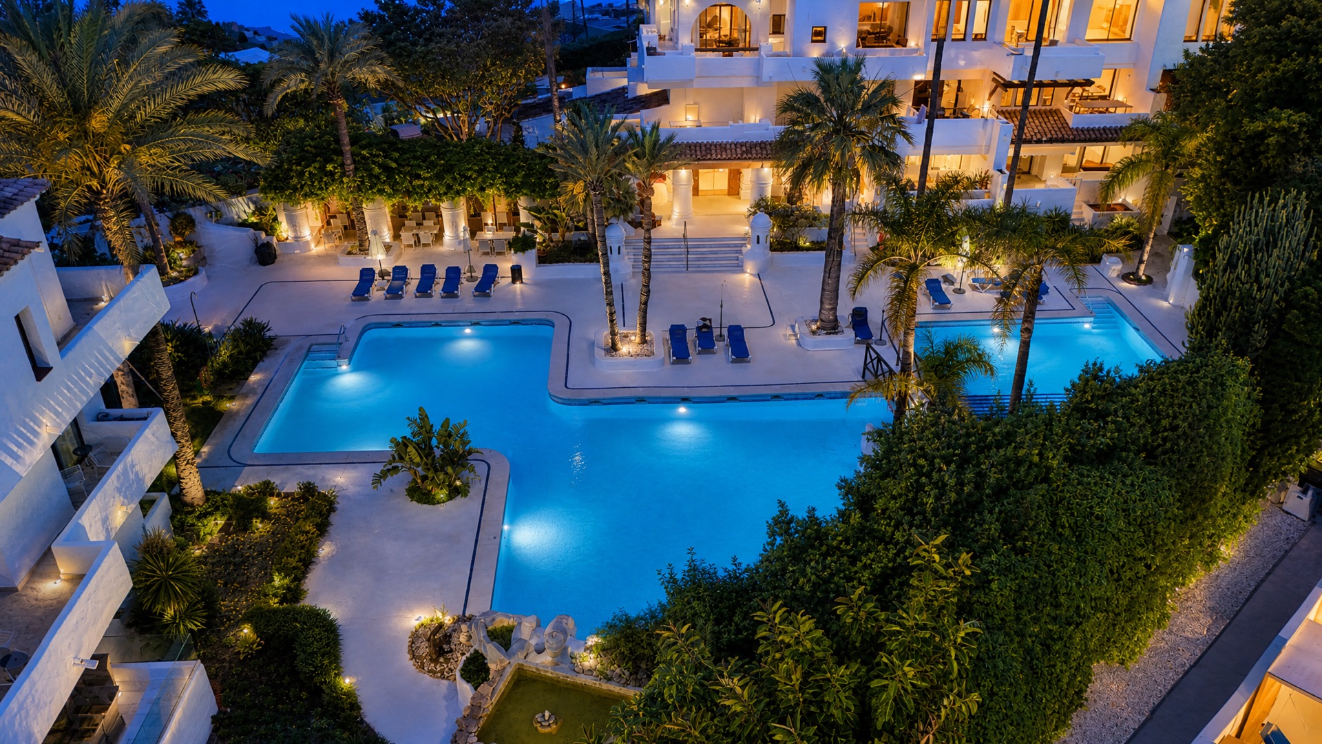 Communal pool at dusk at the La Isla penthouse