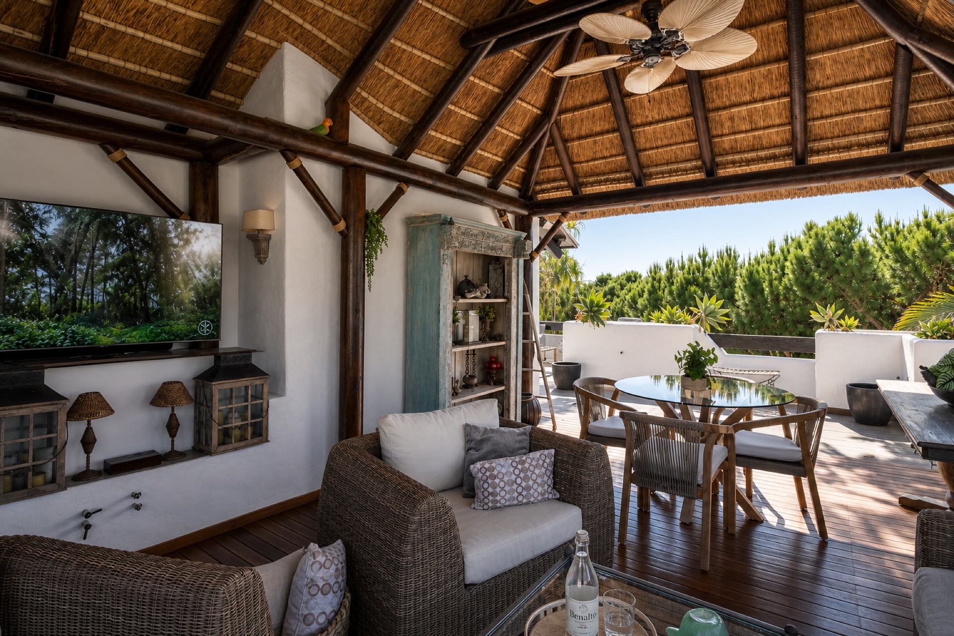 Covered terrace with lounge and dining at the La Isla penthouse