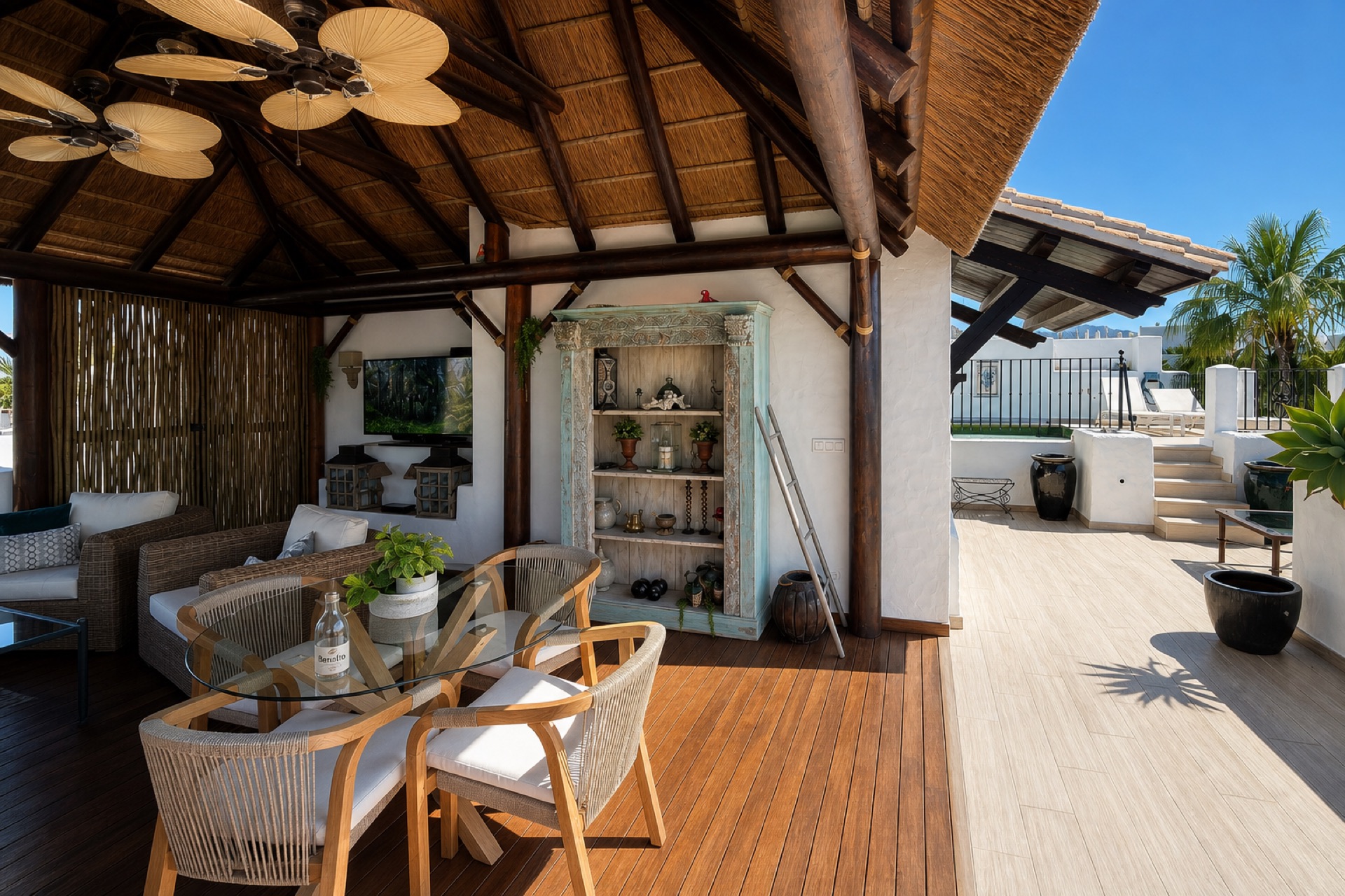 Covered terrace with lounge at the La Isla penthouse