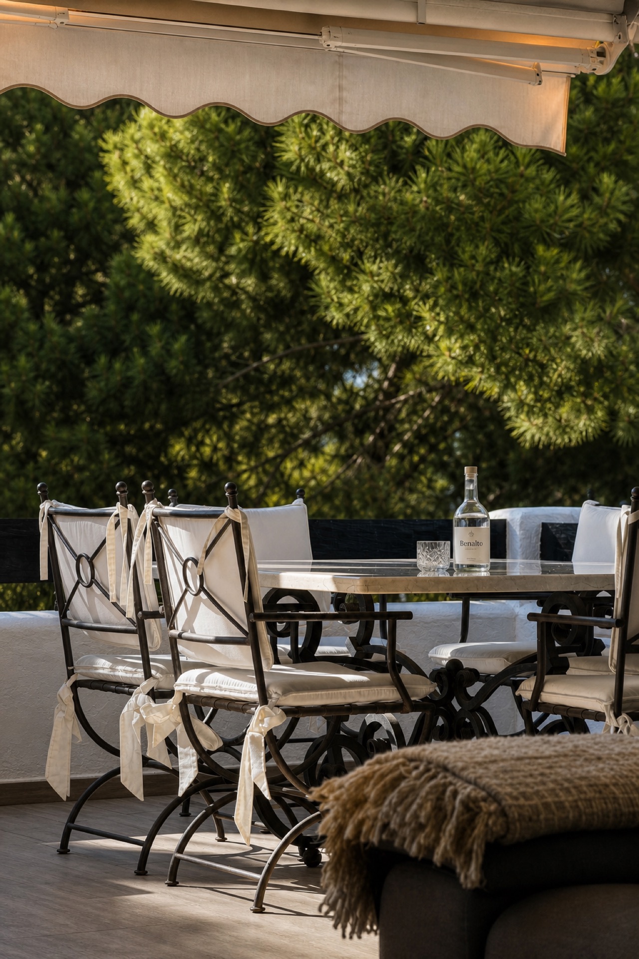 Sunlit terrace dining area at the La Isla penthouse