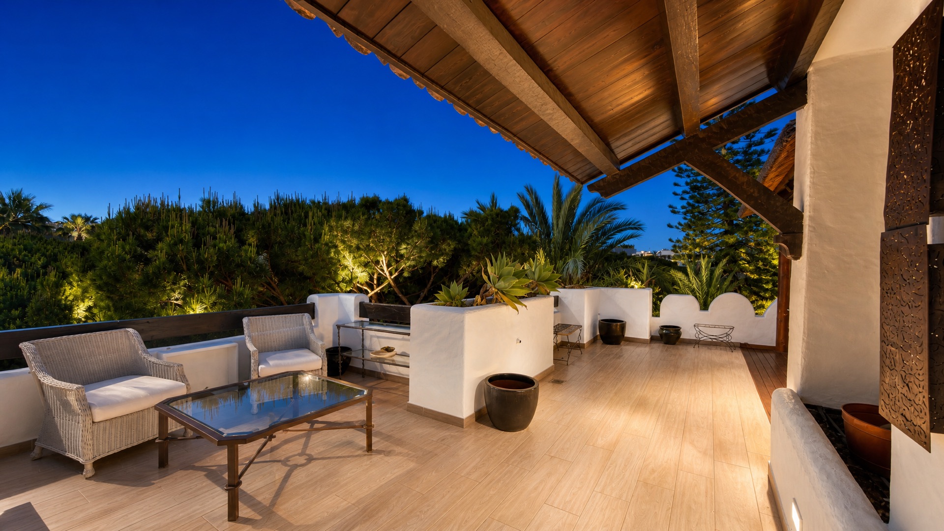 Covered terrace evening views at the La Isla penthouse