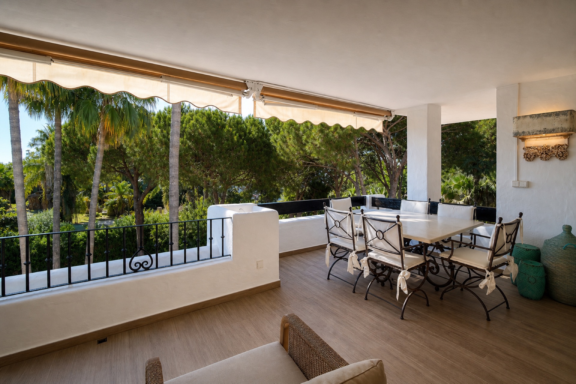 Covered terrace with dining area at the La Isla penthouse