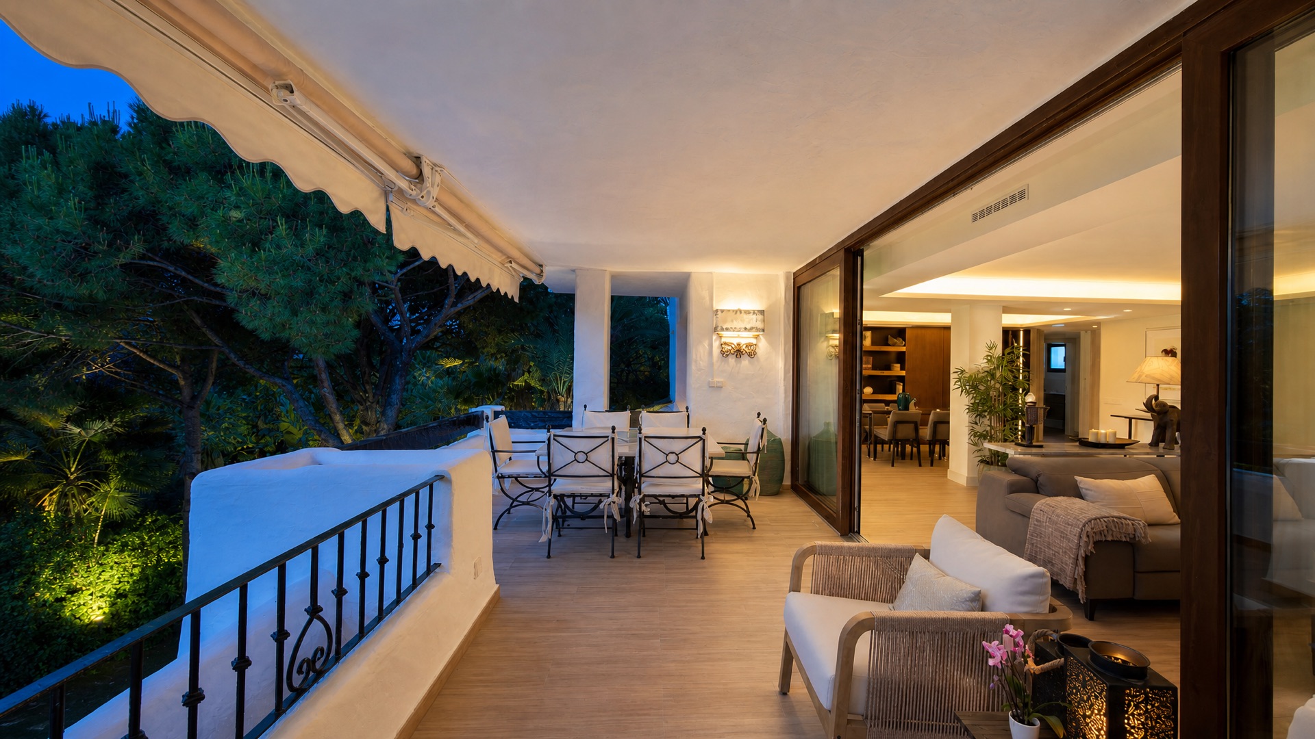Covered terrace with lounge and dining at the La Isla penthouse