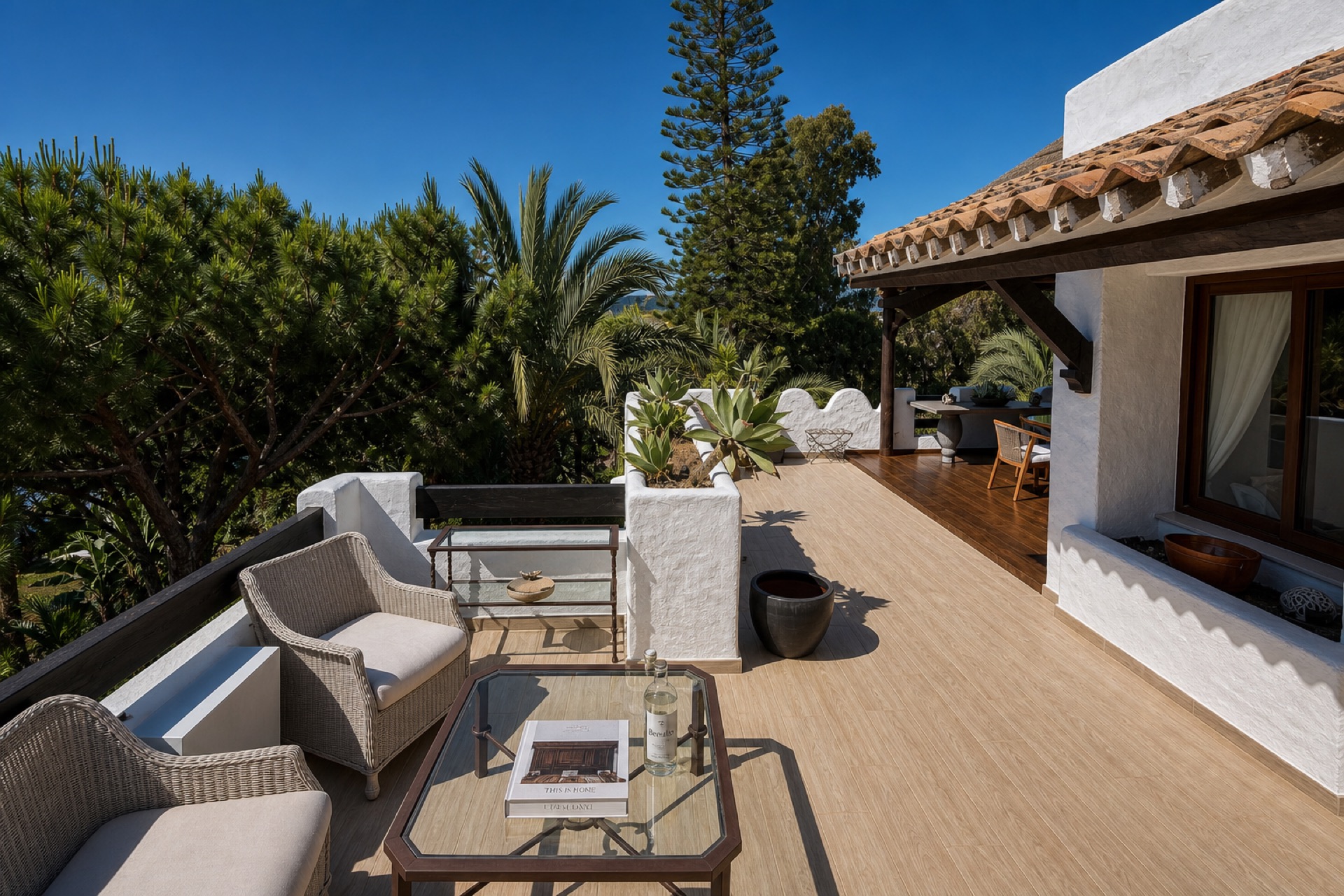 Sunny private terrace with seating at the La Isla penthouse